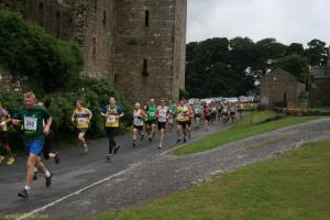 Runners passing Bolton Castle from start.